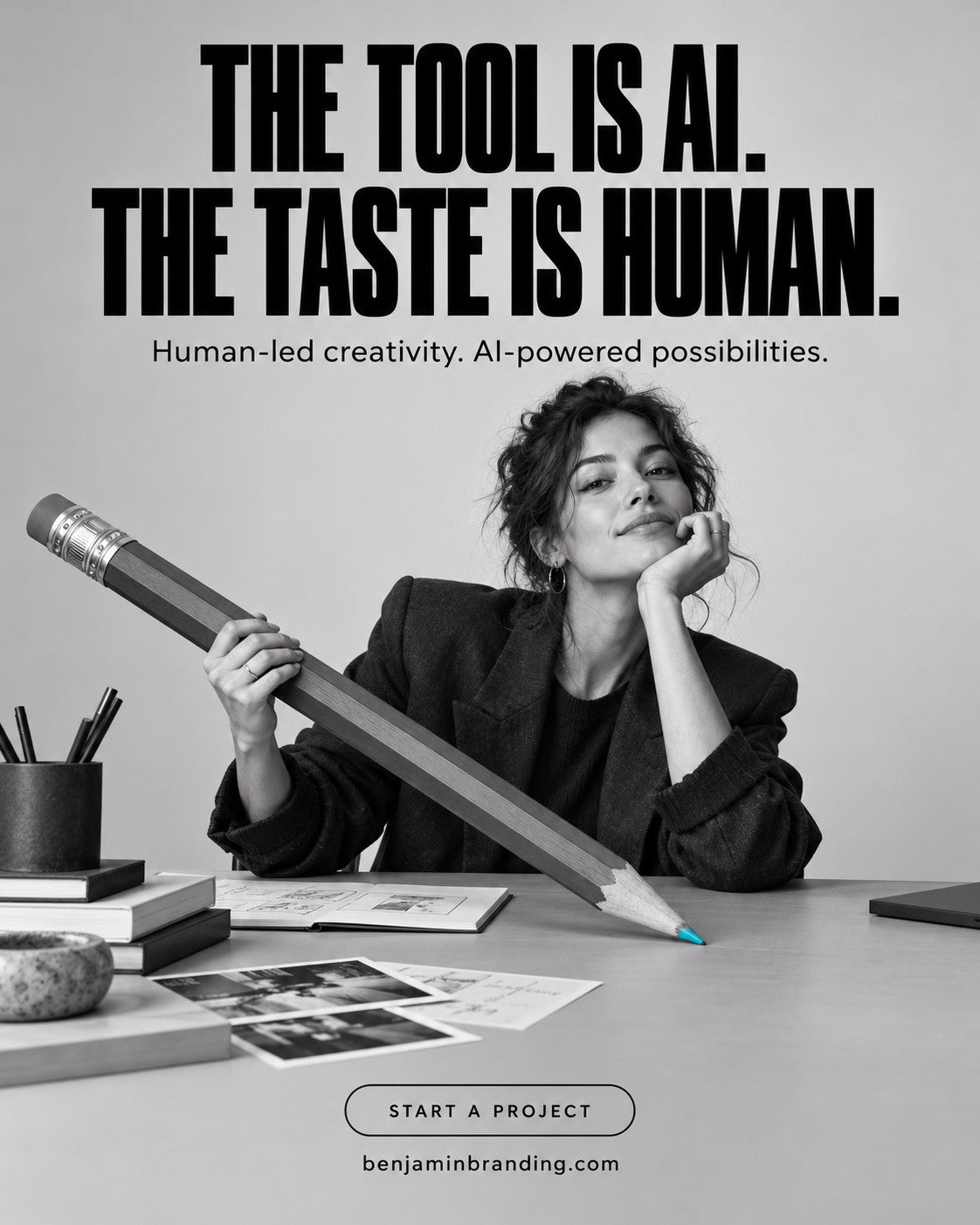 A woman holding an oversized pencil at a creative desk. Benjamin Branding creative: The tool is AI. The taste is human.