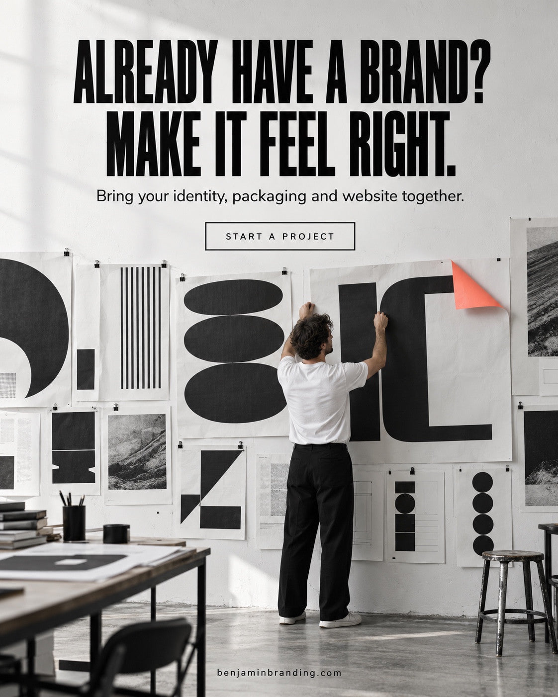 A designer arranging a coordinated black-and-white identity wall. Benjamin Branding creative: Already have a brand? Make it feel right.